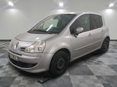 a picture of a small silver car parked in a garage
