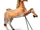 statue of a horse on a stand on a white background