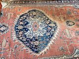 a large oriental rug on the floor in a living room
