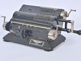 an old type of typewriter machine on a white surface