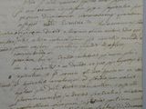a handwritten letter written in black ink on a piece of paper