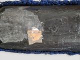 a piece of paper on the bottom of a surfboard