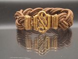 an image of a bracelet with a gold clasp