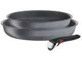 two pans and a knife on a white background