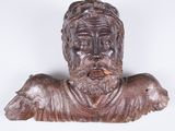 wooden bust of a man with a beard and a hat