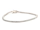 a diamond tennis bracelet on a white background