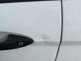 a close up of a car door handle with a black handle