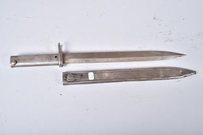 two knives that are laying next to each other on a table