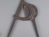 a close up of a metal object on a white surface
