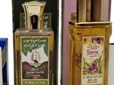 several different types of perfumes are displayed on a white surface
