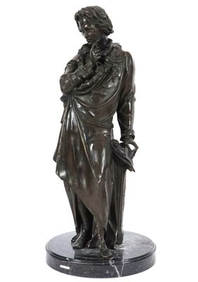 une image représentant une statue en bronze d'une femme tenant un livre