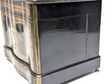 a black box with a gold trim on it