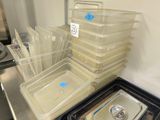 several plastic containers are stacked on top of each other in a kitchen
