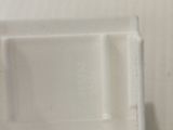 a white tray with a toothbrush and toothpaste in it
