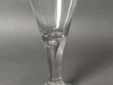 a wine glass that is sitting on a table