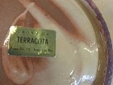 a close up of a plate with a name tag on it