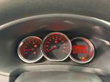 three gauges on the dashboard of a car