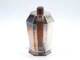 an image of a silver vase with a wooden lid