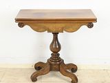 an image of a small table with a wooden top on a tile floor