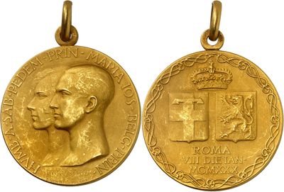 two gold medals with a man ' s head and a cross on them
