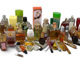 many different types of perfumes and bottles on a white surface
