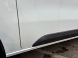 the side of a white car with a black stripe on it