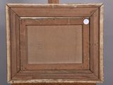 an old wooden easel with a painting on top of it