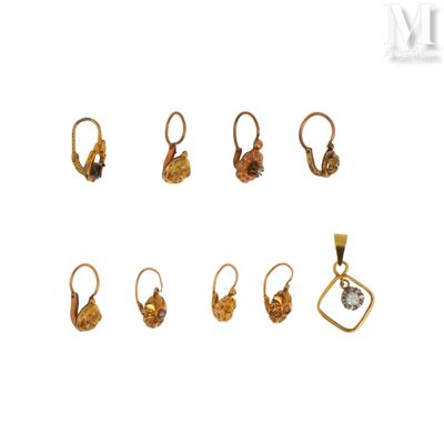 an image of a set of five pairs of earrings and a pendant