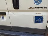 a white van with a handicap sign on the side of it