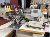 a sewing machine that is sitting on a table in a room