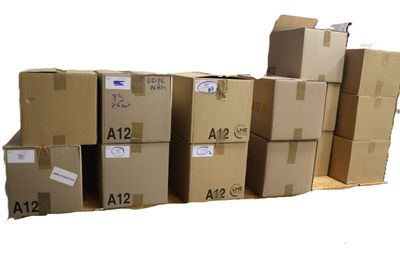 several cardboard boxes stacked on top of each other on a pallet