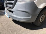 a silver van parked on the side of the road