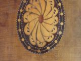 a picture of a wooden table with a decorative object on it