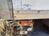 an image of a truck that has been pulled over by hay