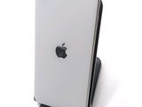a close up of an apple phone on a stand