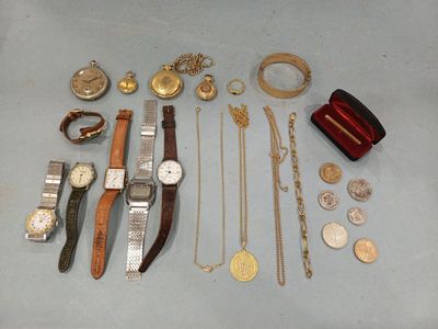 many different types of watches and bracelets laid out on a table