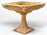 un socle ancien en bois surmonté d'un bol