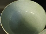 a close up of a blue and white bowl on a table