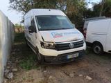 a white van that is parked next to a white van