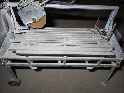a machine that is cutting a sheet of metal