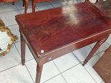 a small table with a mirror on top of it