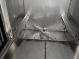 an open oven with the door open in a kitchen
