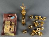 several brass door handles and knobs in a package on a table