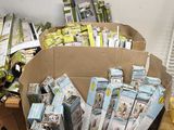 many boxes of books in the middle of a room