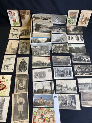 a table topped with lots of old black and white photos