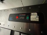 an image of a machine that is working on a piece of metal