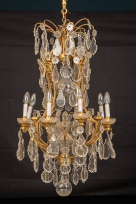 Lustre en bronze et cristaux à seize lumières - Photo 1