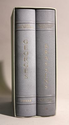 two books that are sitting side by side on a table