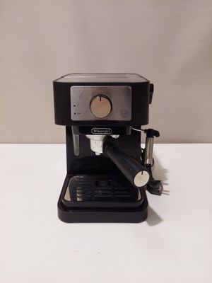 an image of a black coffee machine sitting on top of a white table