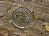 an image of a close up of a piece of wood with a coin on it
